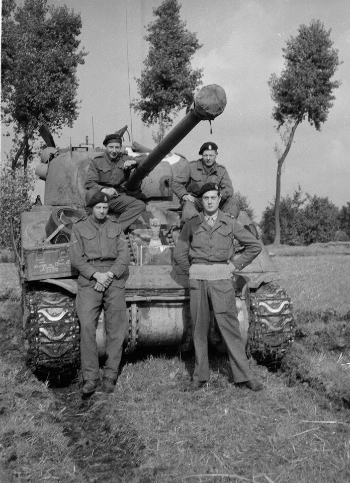 Members of 'B' Squadron, 3rd/4th County of London Yeomanry (Sharpshooters) pose next to Sherman Firefly tank