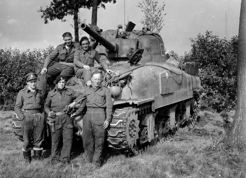 A 3rd/4th County of London Yeomanry (Sharpshooters) tank crew pose in ...