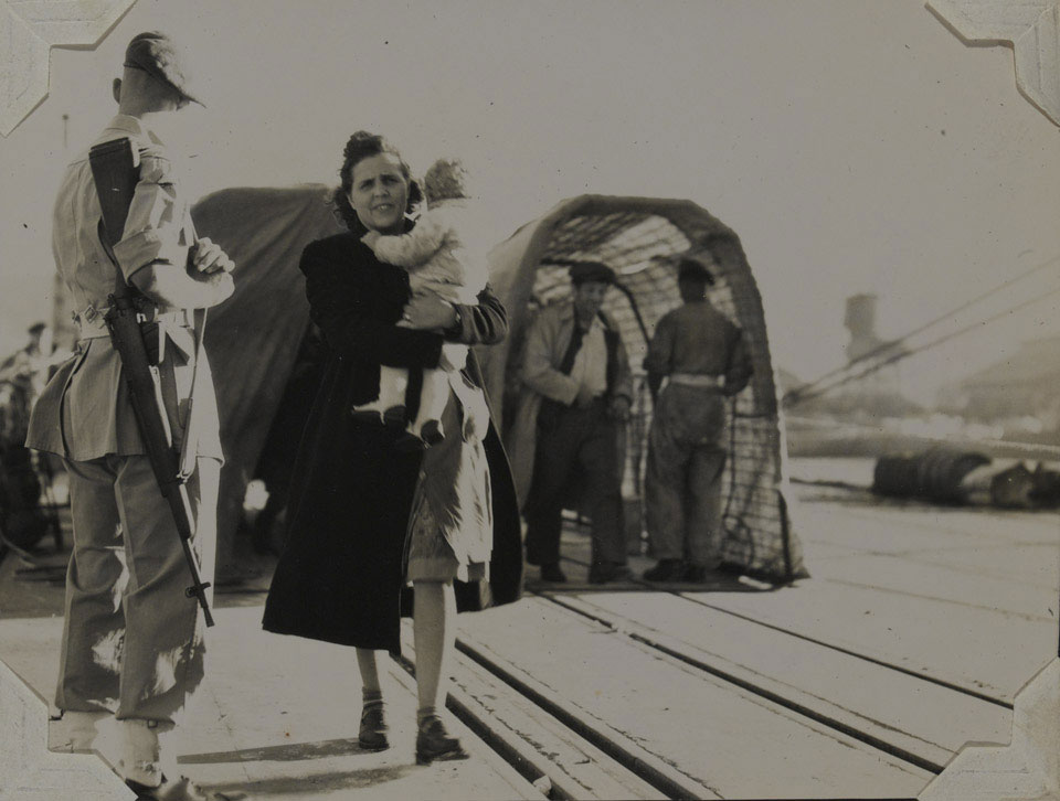 A Jewish women and her child arrive at Haifa Docks, Palestine, 1947