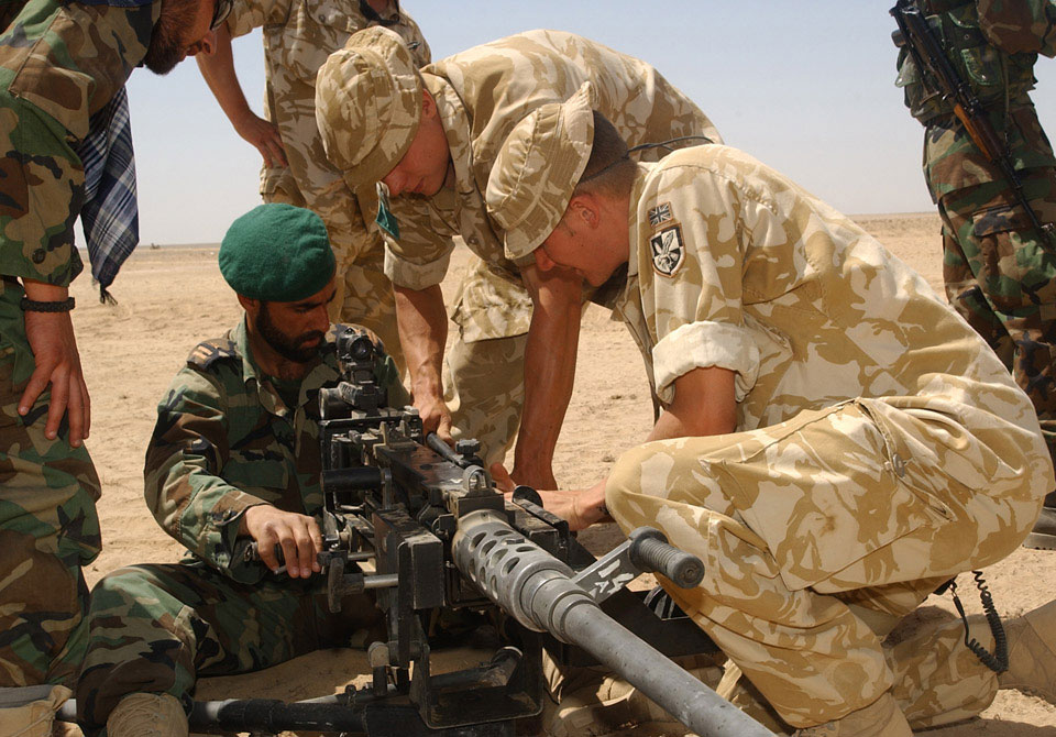 Members of 3rd Battalion, The Parachute Regiment, training Afghans in the use of the Browning .50 Calibre machine gun, 2006