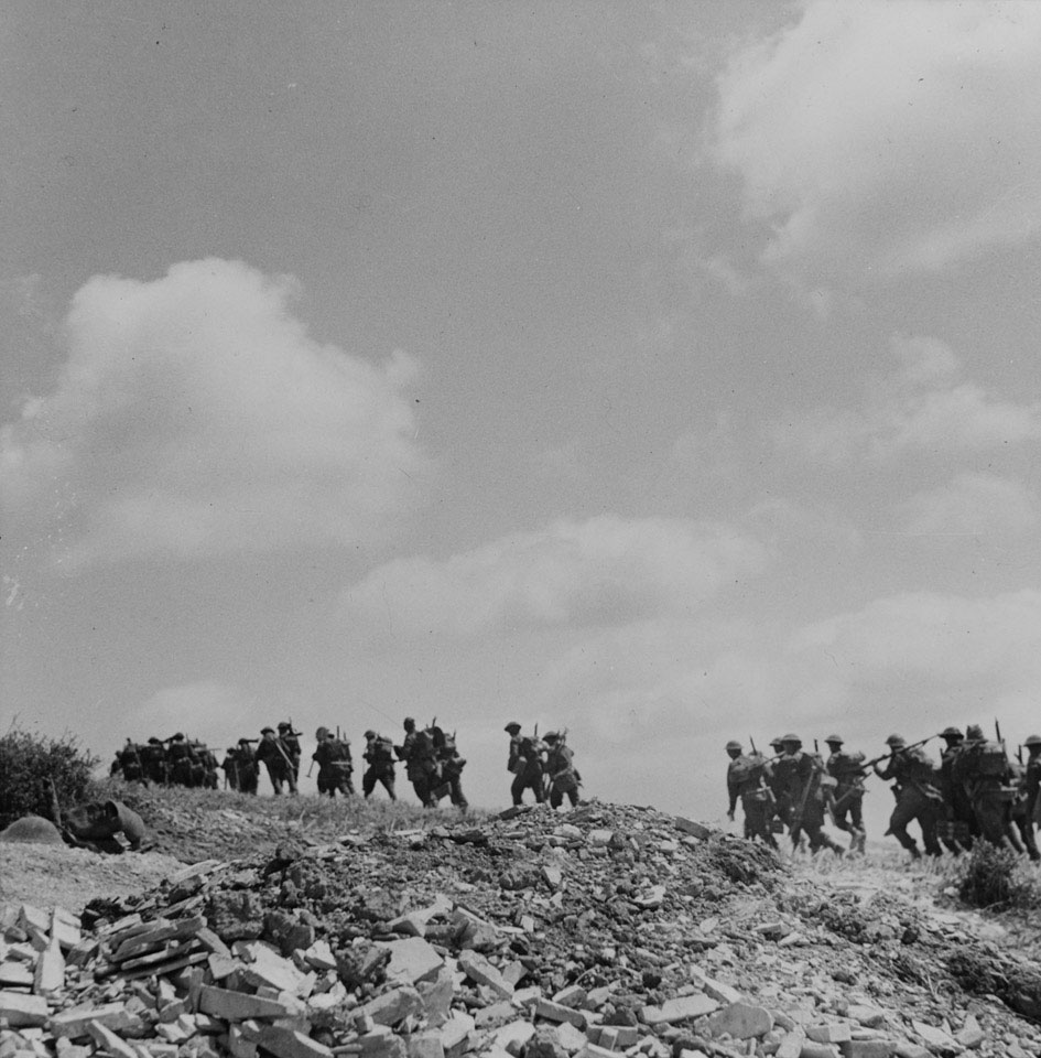 1st Battalion, The East Surrey Regiment, moving up to the front line during the First Army's attack on Recce Ridge, April 1943