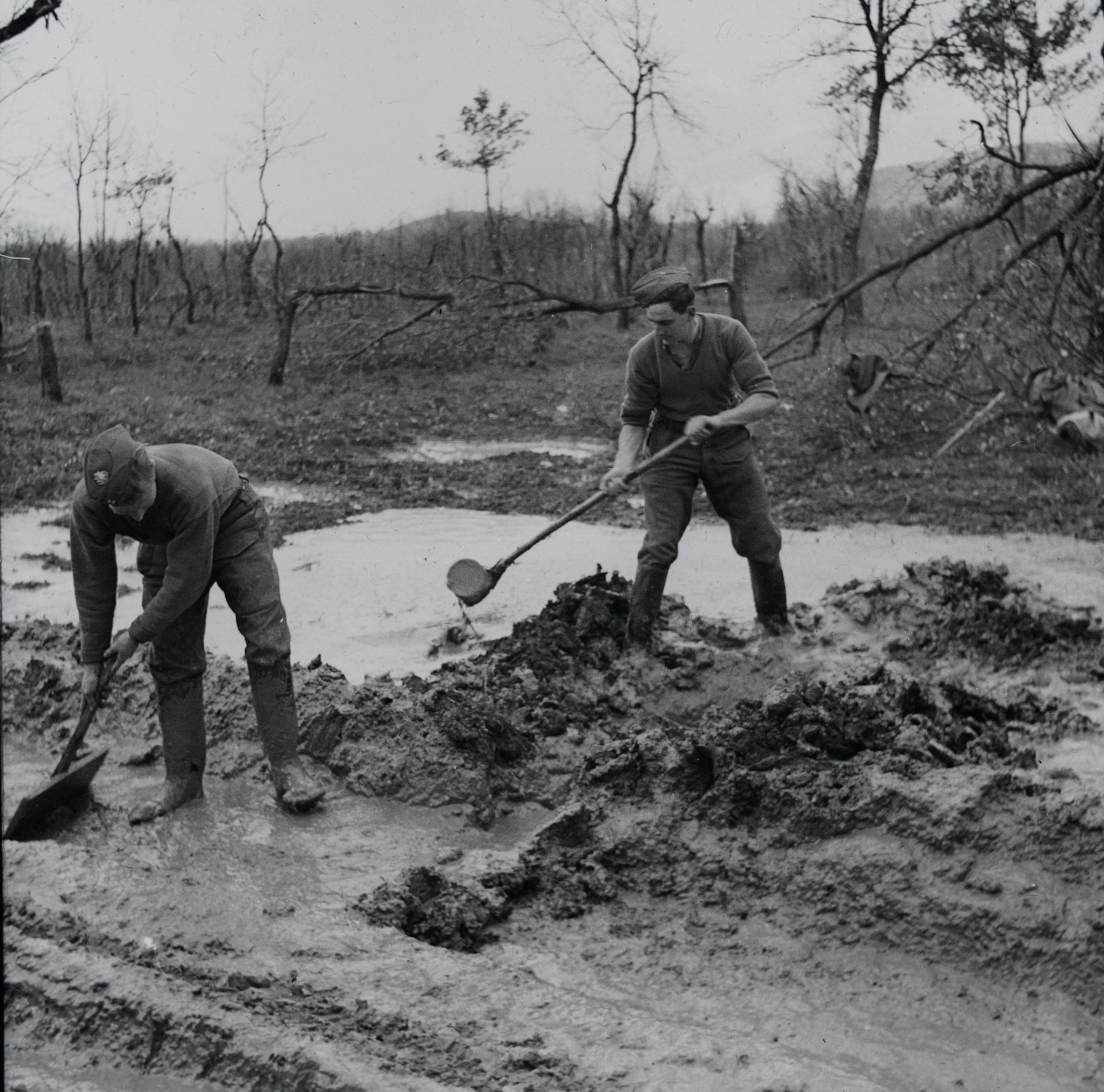 Clearing mud from the 1st East Surrey Regiment's position on the Rapido River, March 1944