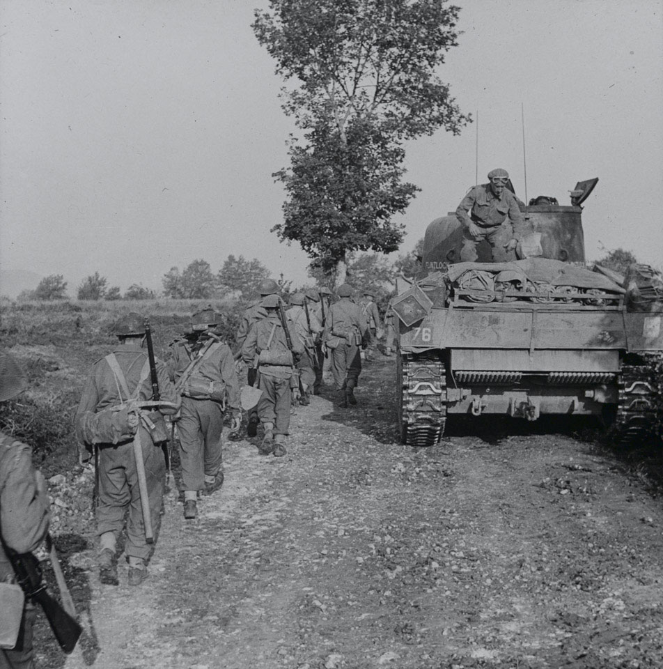 Infantry and tanks moving along a track towards the Hitler Line, Italy, May 1944