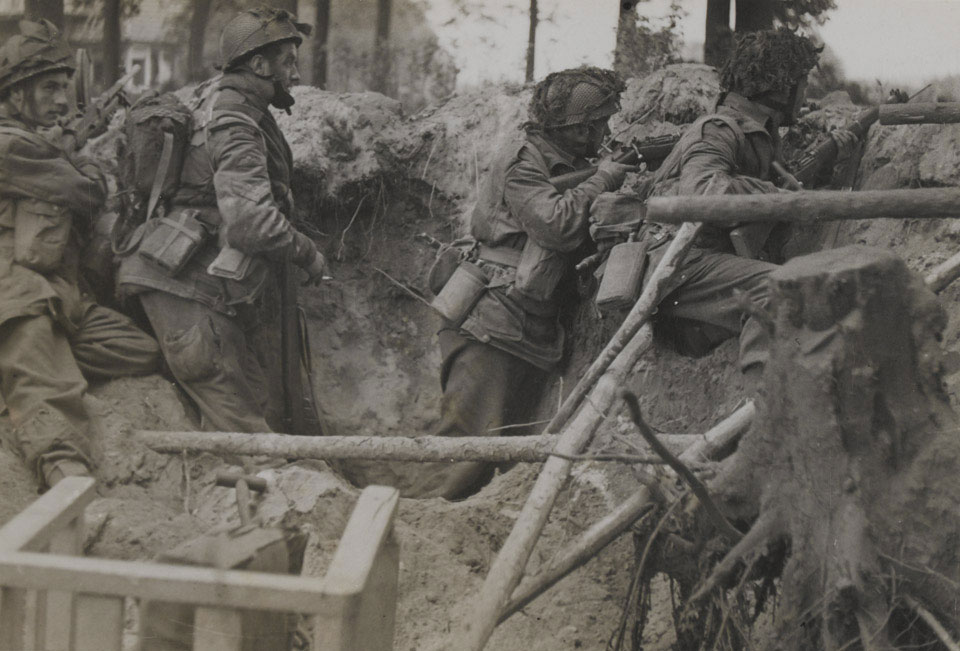 Members of 1st Airborne Division take cover in a shell hole, Arnhem, 17 September 1944