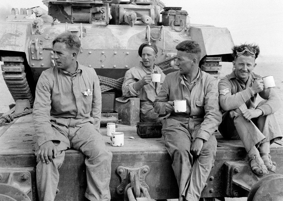 Members of 3rd County of Yeomanry, 7th Armoured Division, seated on ...