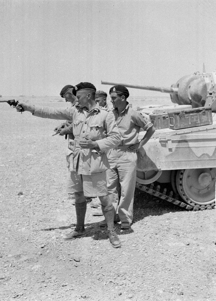 A member of 3rd County of London Yeomanry fires his .38 inch revolver ...