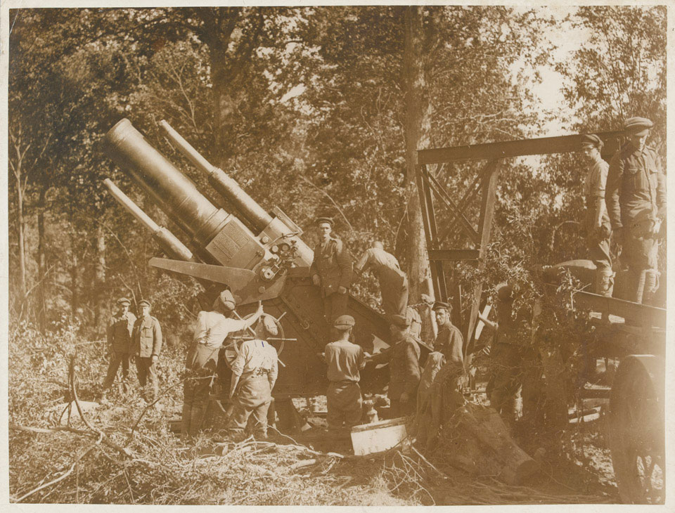 The barrel of a 15-inch howitzer is elevated for firing on the Somme, 1 ...