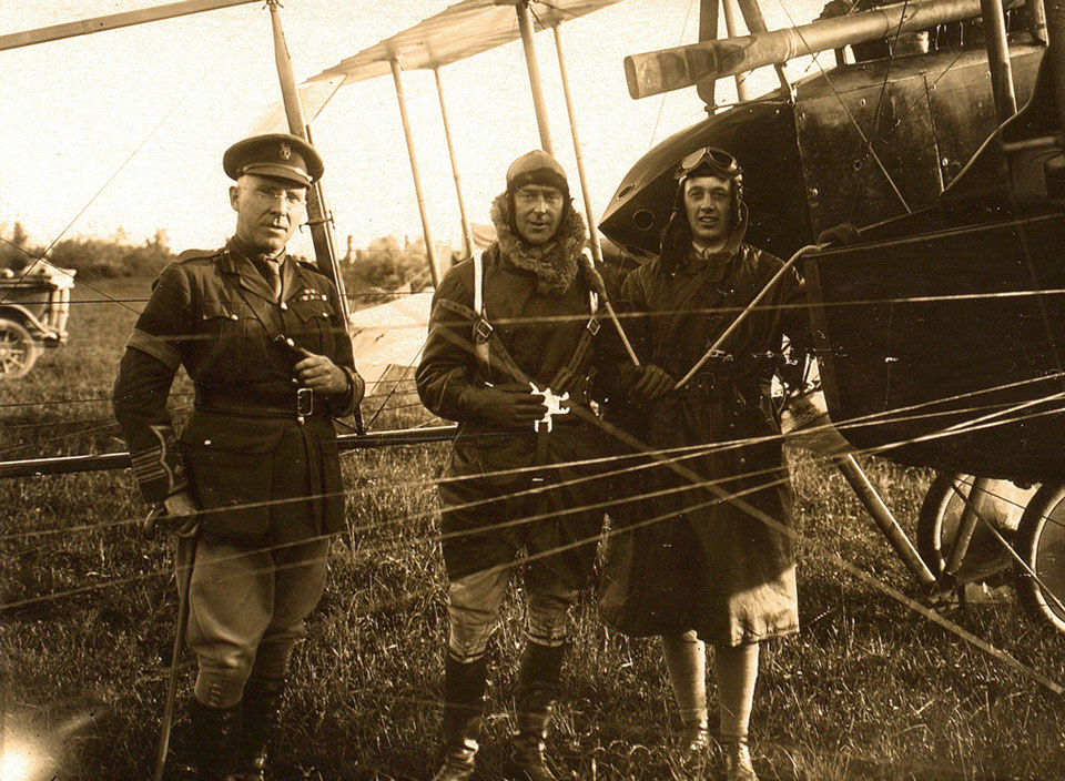 Captain Bowen (centre) wearing the parachute harness before the drop on 26 June 1918