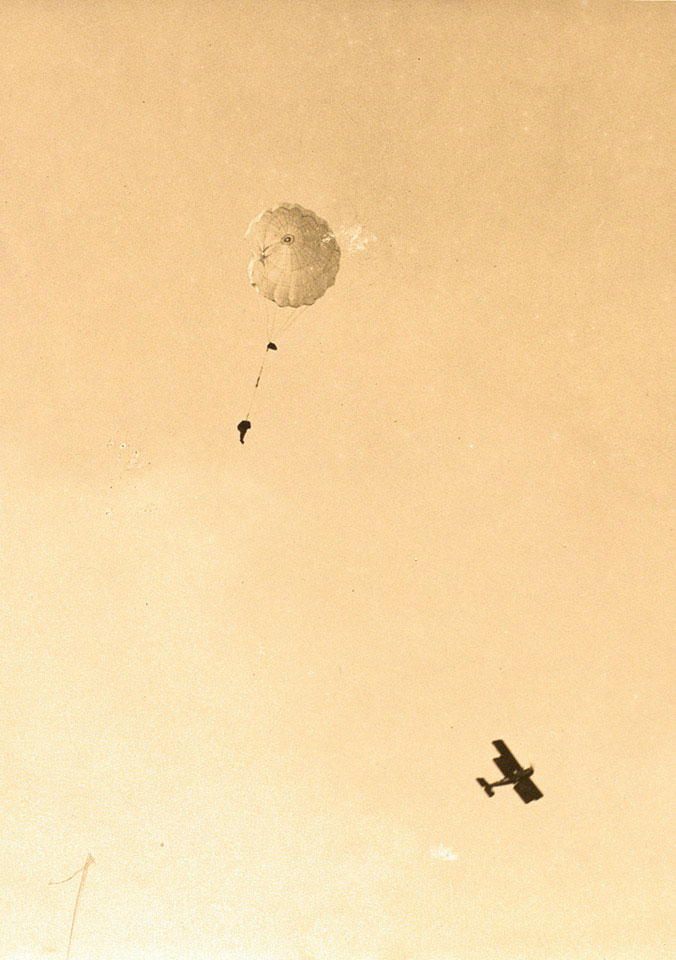Captain Bowen dropping at Grossa aerodrome with an RE8 aircraft visible taking photographs of the test, 26 June 1918