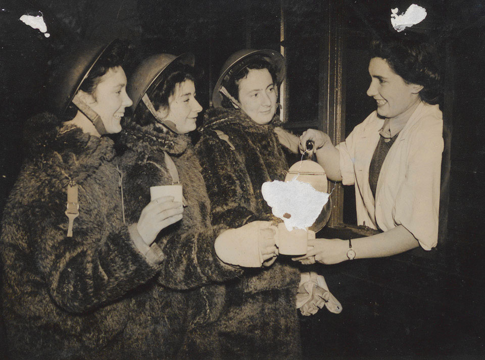 Tea is poured for three members of an Auxiliary Territorial Service ...