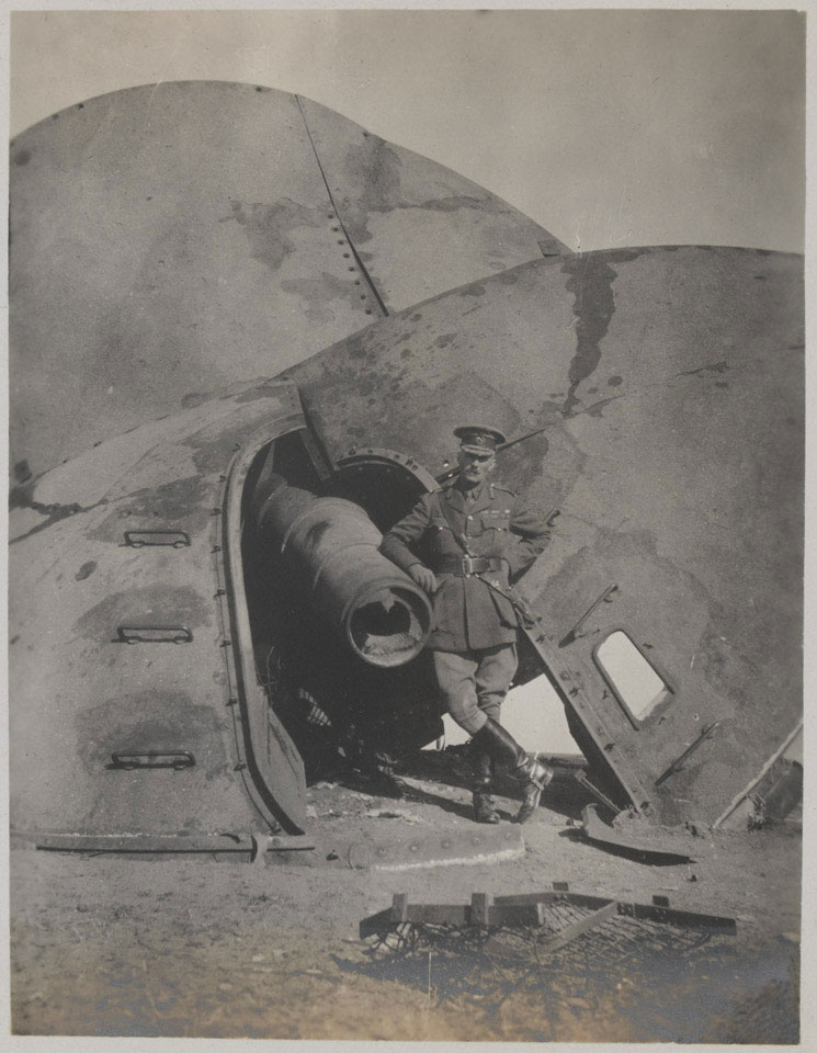 Major-General Barnardiston next to a wrecked gun at Fort C, Tsingtao, November 1914