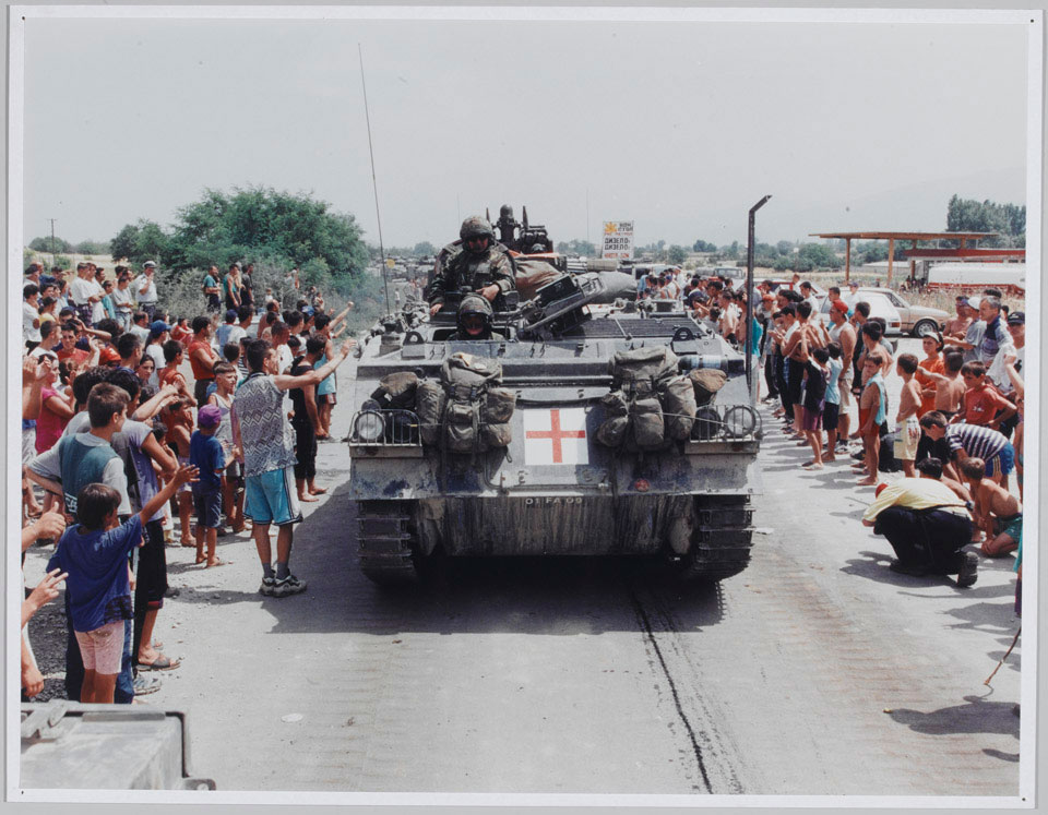 The KFOR invasion passing Stenkovich refugee camp, just inside Macedonia, before crossing into Kosovo, 1999