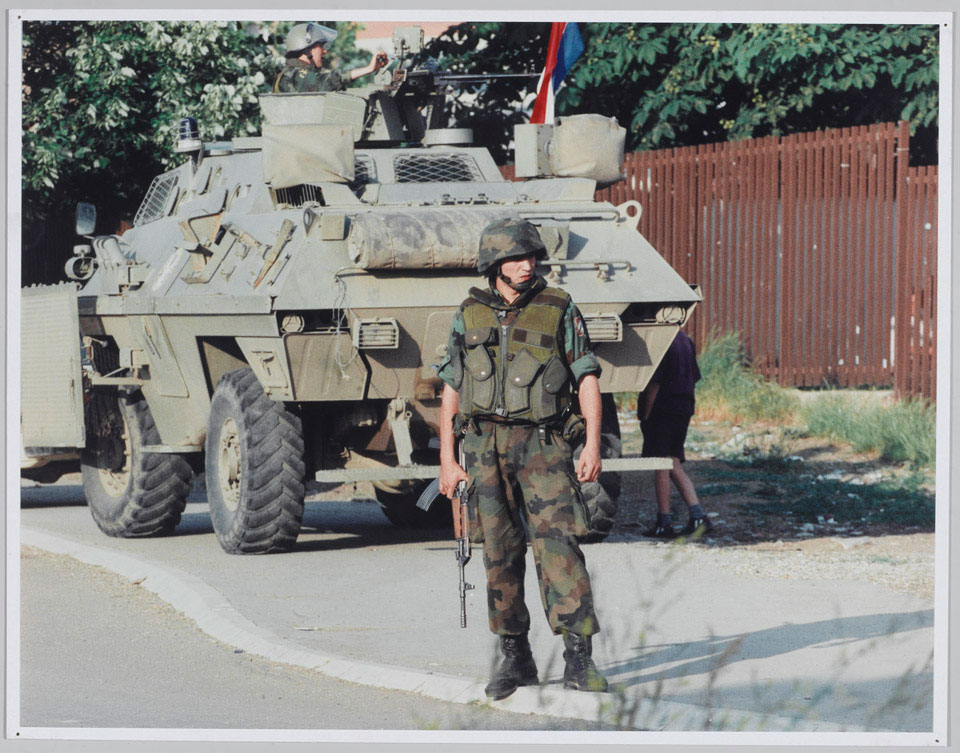 A Serbian armoured car and soldier, 1999