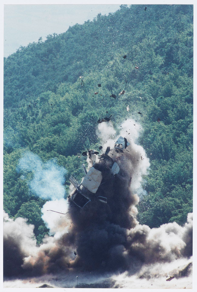 Destruction by Royal Logistic Corps bomb disposal of a car used to transport weapons and explosives, Kosovo, 1999