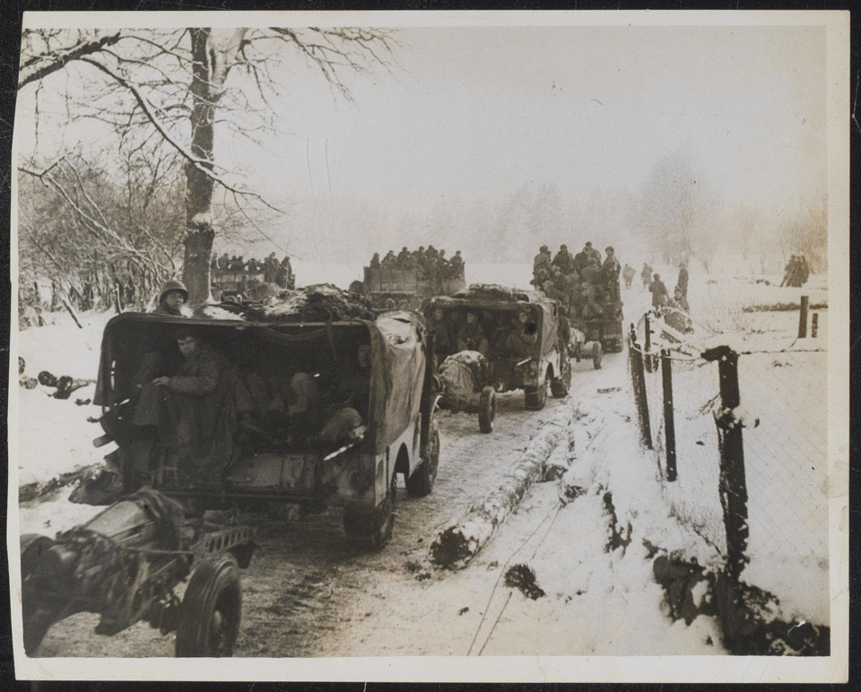 '1st Army infantry in trucks passing through Fosse to cut the Laroche St Vith supply route, Ardennes', 1944