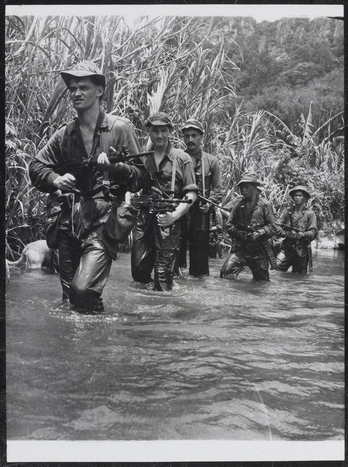 New Zealanders of 22 Squadron Special Air Service patrol the Malayan jungle, August 1957