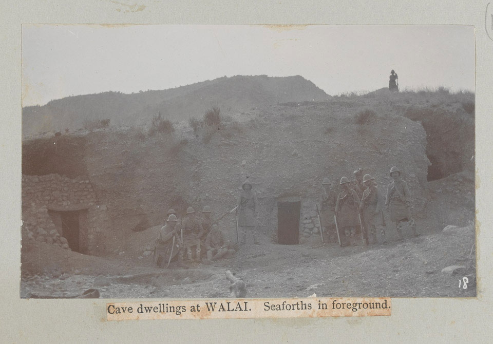 'Cave dwellings at Walai, Seaforths in foreground', 1908