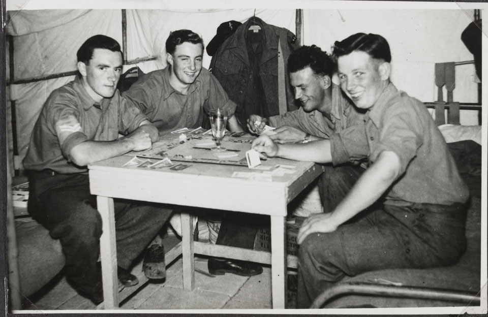 Members of the Royal Electrical and Mechanical Engineers enjoy a break in their duties at Tobruk Camp in the Canal Zone, 1953