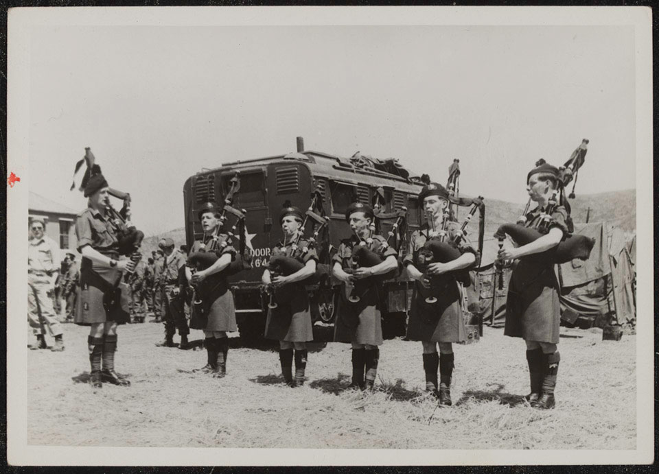 Pipers of The Royal Ulster Rifles playing at the ceremony to award the Presidential Unit citation to The Gloucestershire Regiment, May 1951