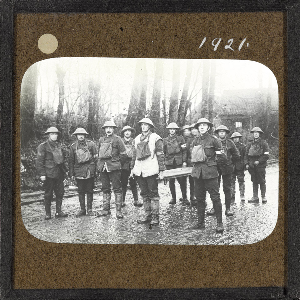Stretcher bearers from the Sherwood Foresters stand on a road in Fonquevillers, March 1917
