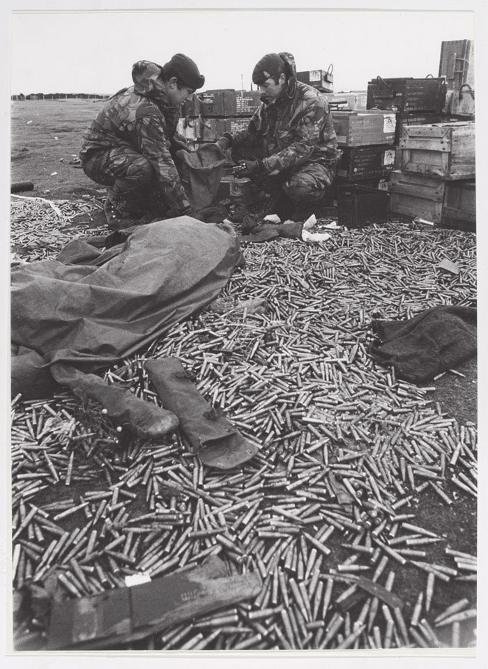 Royal Army Ordnance Corps personnel sorting out small arms ammunition abandoned by the Argentines at Goose Green, 1982