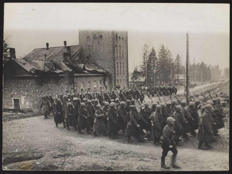 Red Army infantry marching through a village on their way to the war front, November 1943