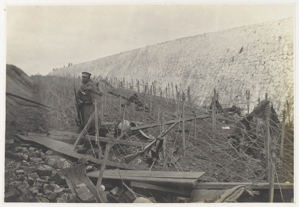Japanese sentry among barbed wire entanglements, Tsingtao, November 1914