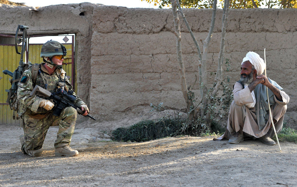 A soldier of the 1st Battalion, Royal Irish Regiment on patrol in the Nad-e-Ali area of Helmand Province, Afghanistan, October 2010