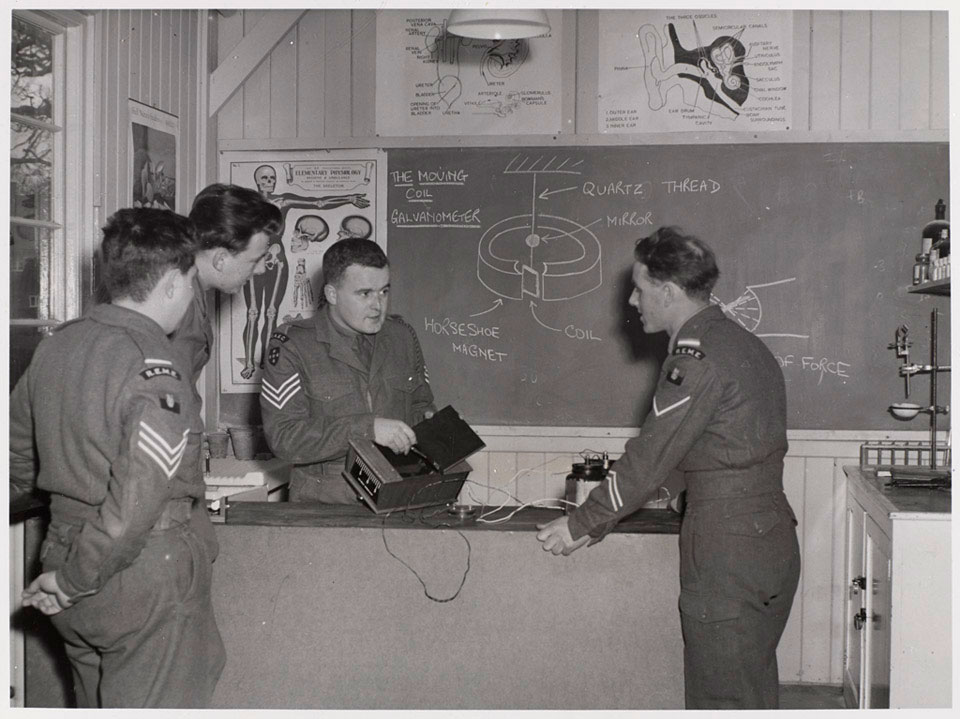 A RAEC sergeant instructs men from the Royal Electrical and Mechanical Engineers, 1955 (c)