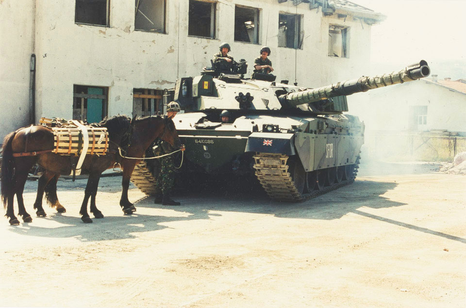 King's Royal Hussars Challenger 1 tank alongside pack horses, Mrkonjic Grad area, Bosnia, 1997
