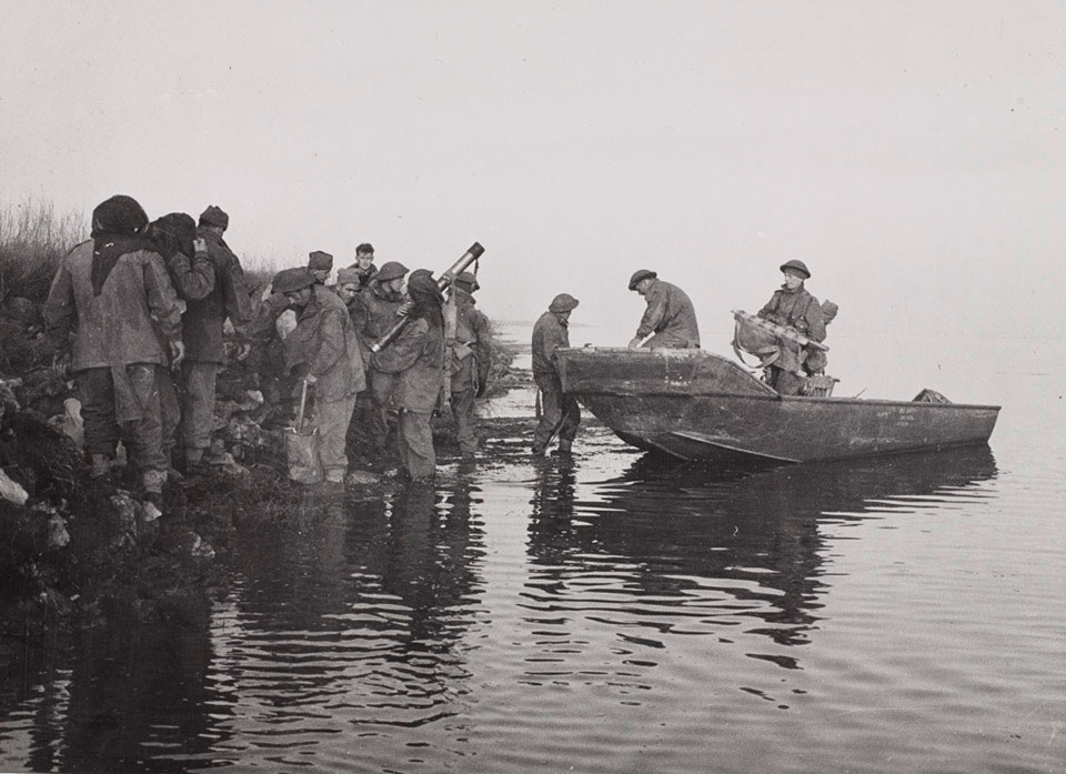 Men of 40 Royal Marine Commando unload a boat at Lake Comacchio, Italy, 11 April 1945