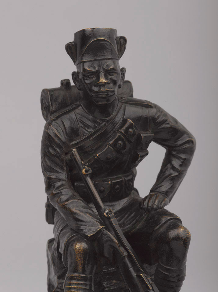 Statuette of an askari of the King's African Rifles in marching order ...