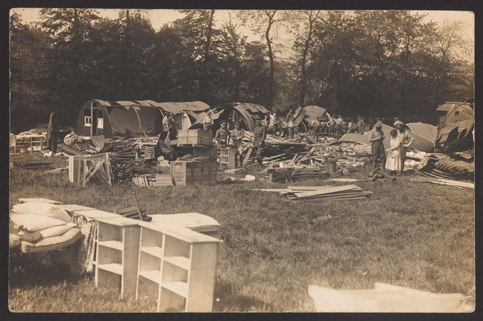 Members of the Queen Mary's Army Auxiliary Corps clearing up after an air raid at Abbeville, May