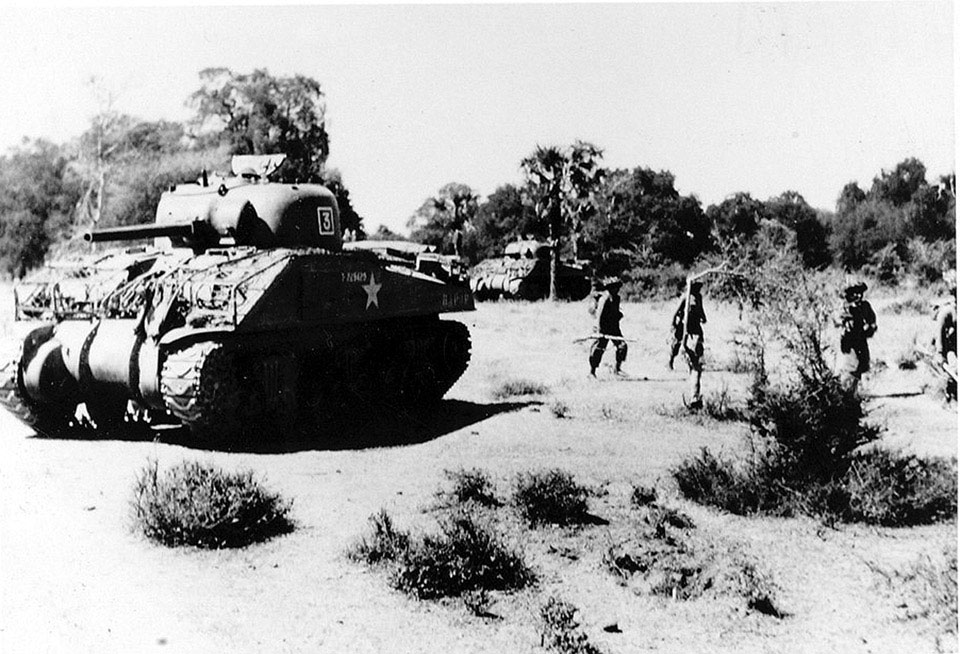 Sherman tank of the 9th Royal Deccan Horse, advancing with infantry, Burma, 1945