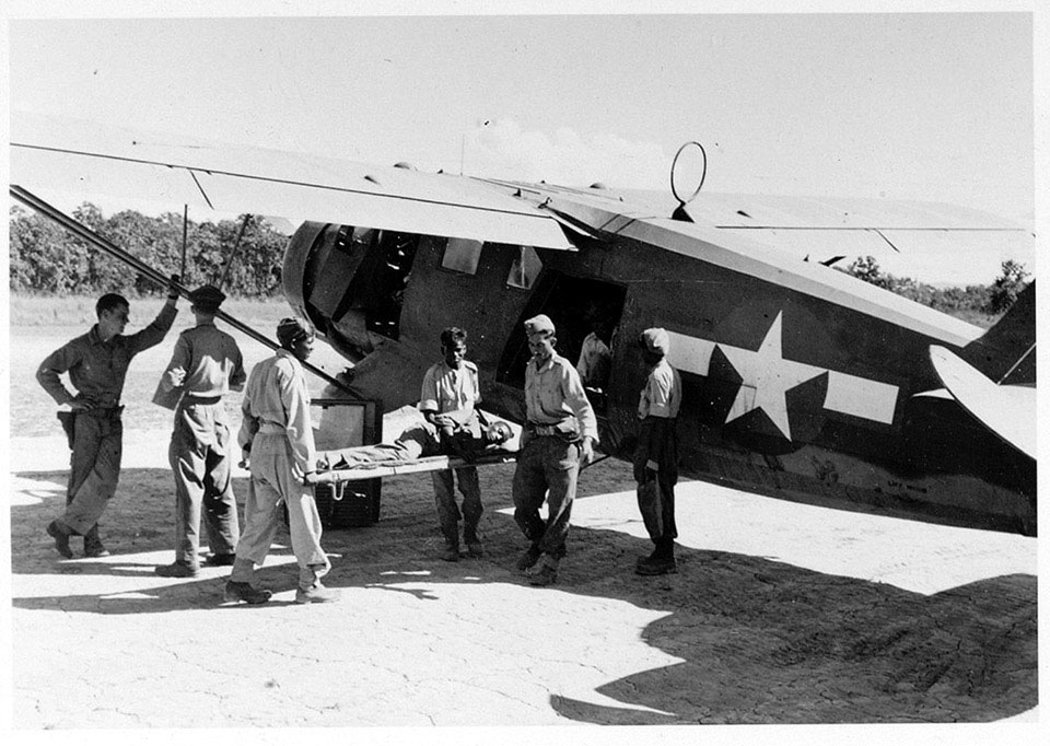 A wounded askari being evacuated by air, Burma, 1944 (c)