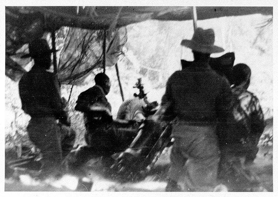 East African gunners firing on Japanese defences from a typical jungle position, Kalewa, Burma, 1944 (c)