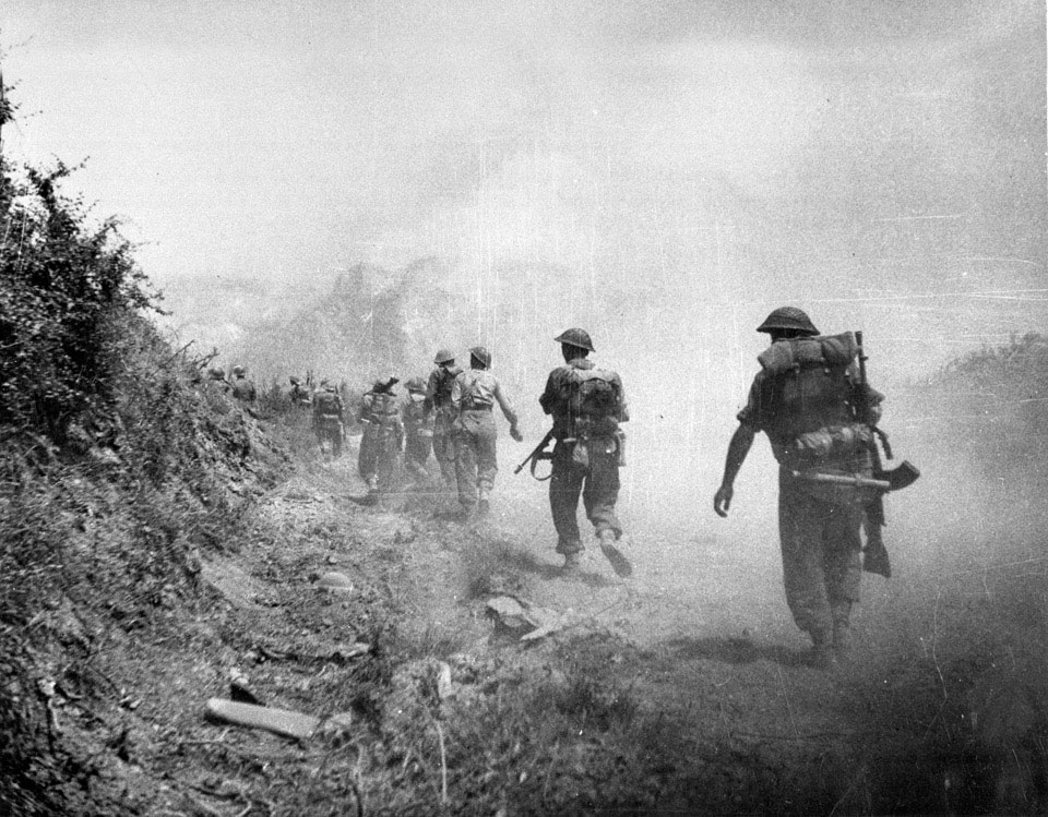 British troops moving through a smoke screen past Monastery Hill into Cassino, Italy, 1944