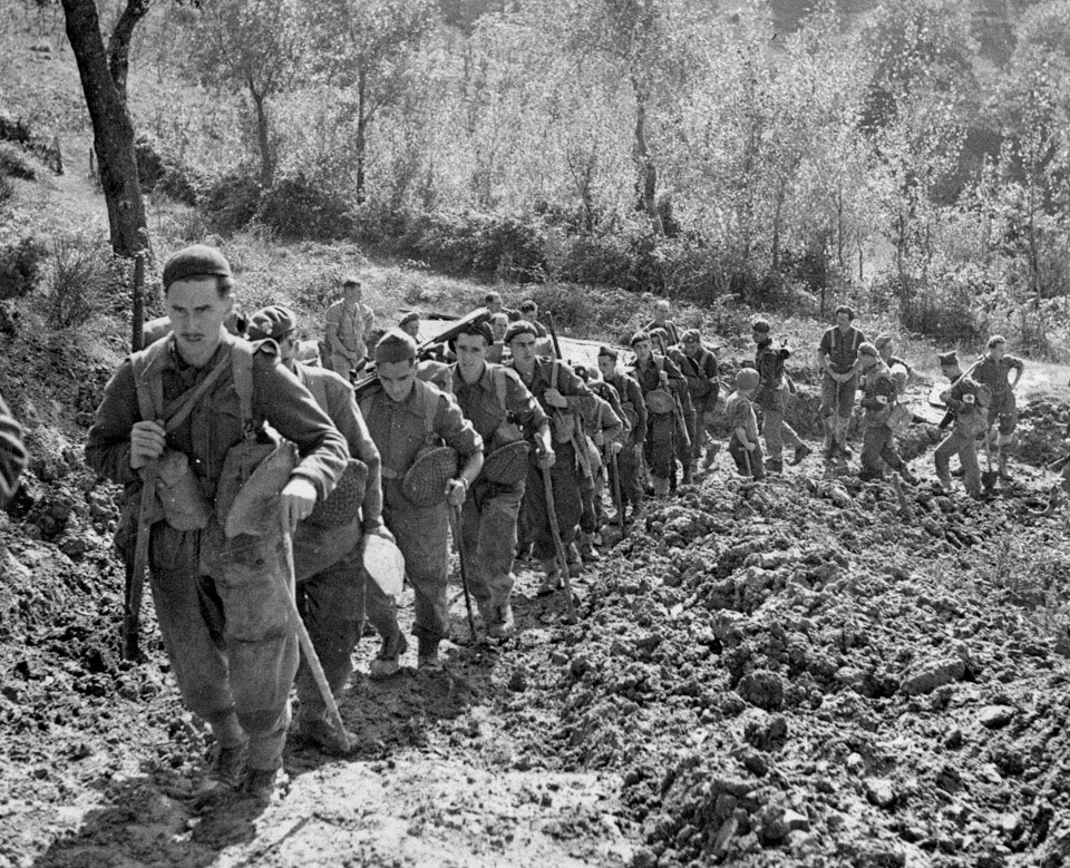 Grenadier Guards climbing a steep road to their forward positions, 1944 