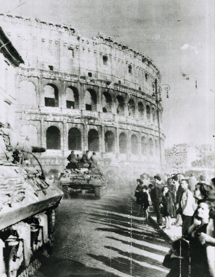 Tanks of the 5th Army pass the Colosseum as cheering Romans welcome the liberators, 4 June 1944