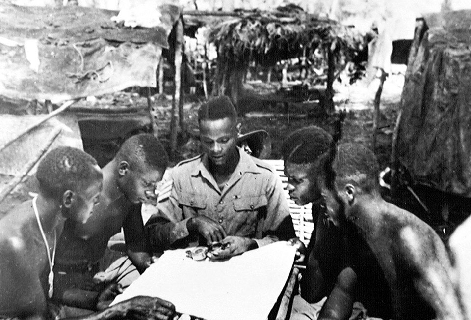 Sergeant Makindi giving the battalion snipers lessons in compass-reading, Burma, 1944 (c)