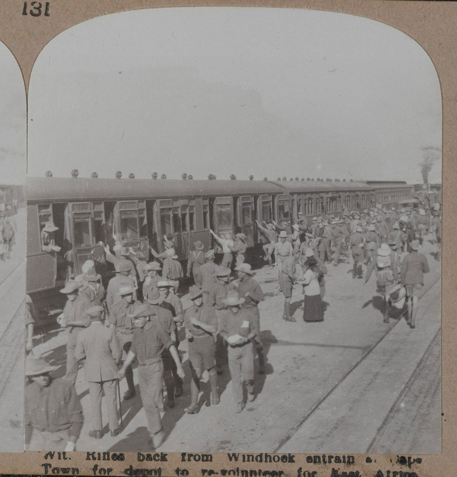 'Rifles back from Windhoek entrain at Cape Town for depot to re-volunteer for East Africa', 1915 (c)
