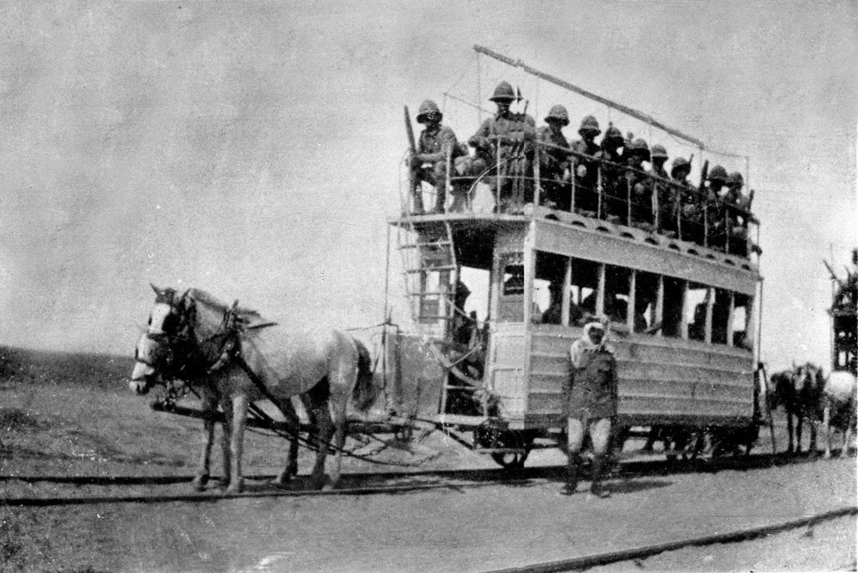 A tram on rails being pulled by horses, on the way to relieve Kut, 1916 (c)