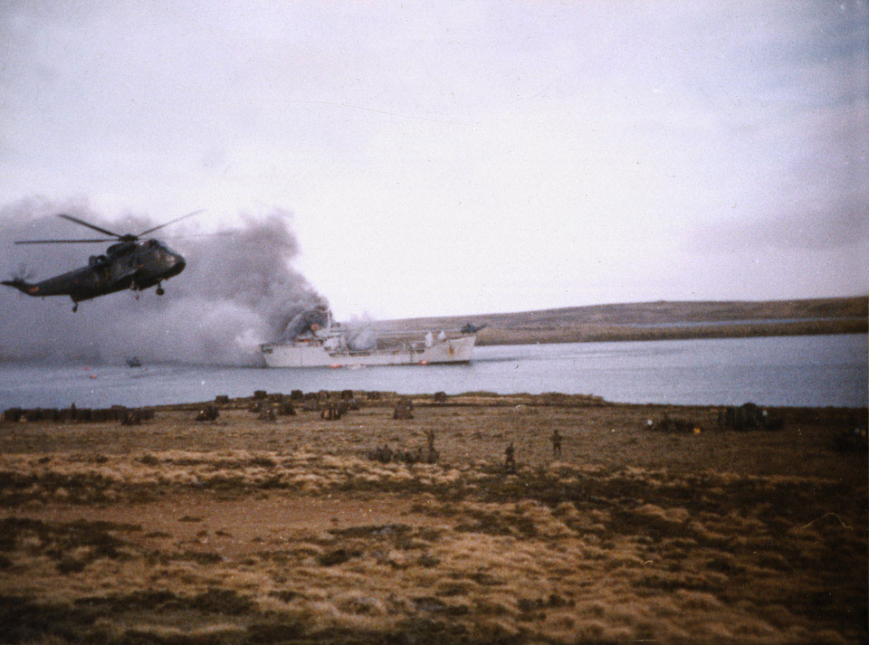Sea King helicopter carries survivors from the RFA Sir Galahad ashore, Falkland Islands, 8 June 1982