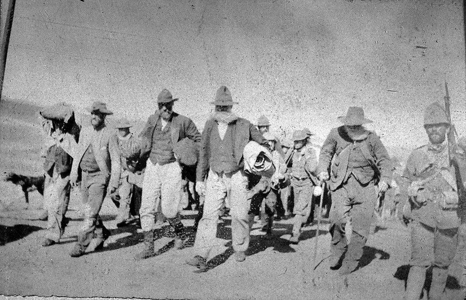Boer prisoners escorted by men of the Durham Light Infantry, 1901 (c)