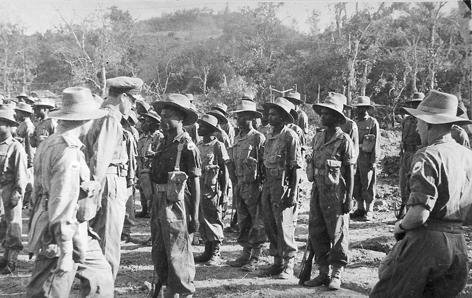 Admiral Lord Louis Mountbatten talking to African non-commissioned officers at Divisional Headquarters, 1945