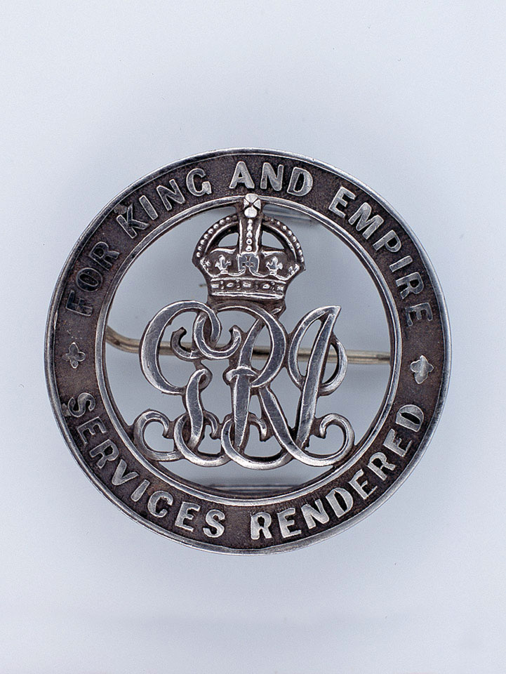 Discharge badge awarded to Private E G Gibbs, 9th Battalion The East Surrey Regiment, 1918