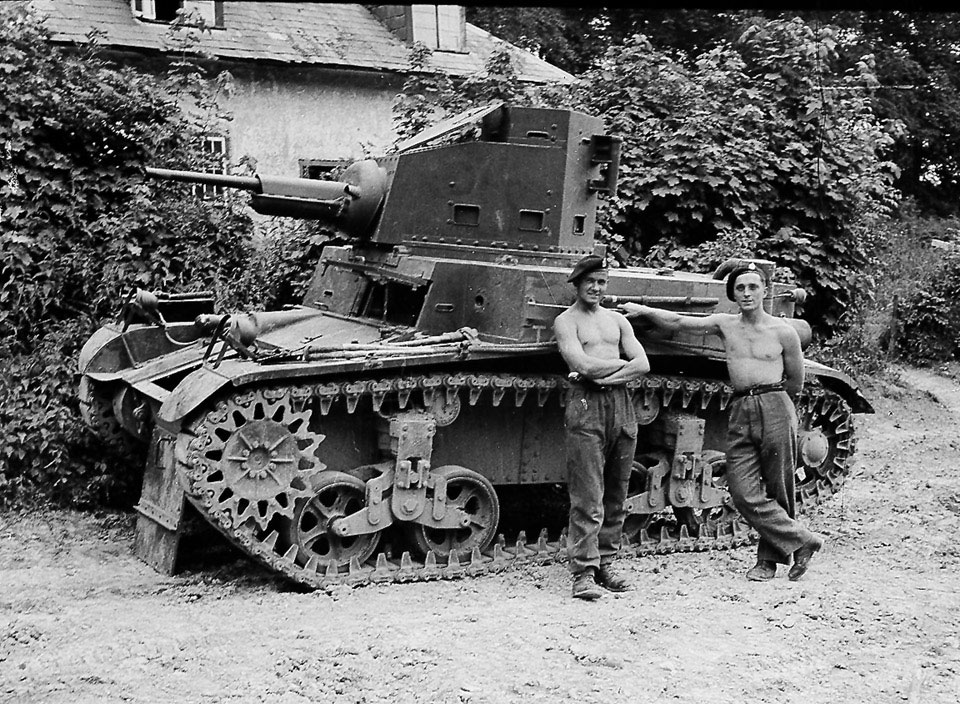 Ken Carroll and Ronnie Mutton standing next to their Honey tank, 3rd County of London Yeomanry (Sharpshooters), Wiltshire, 1941